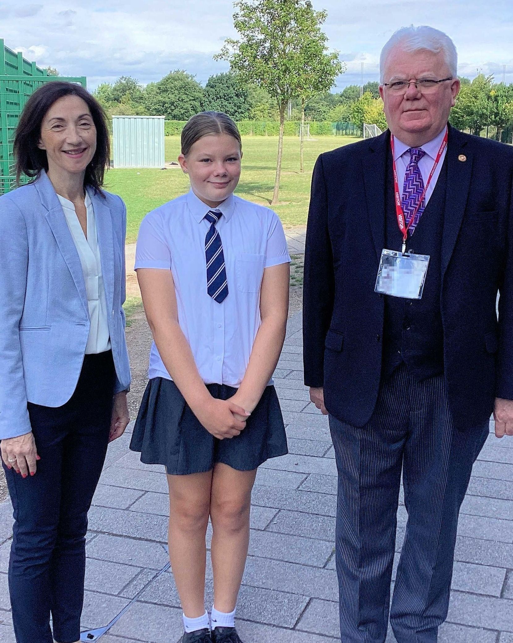 Court Artist winner being presented with her prize by the Deputy Lieutenant of Greater Manchester, and a magistrate from the MIC team.