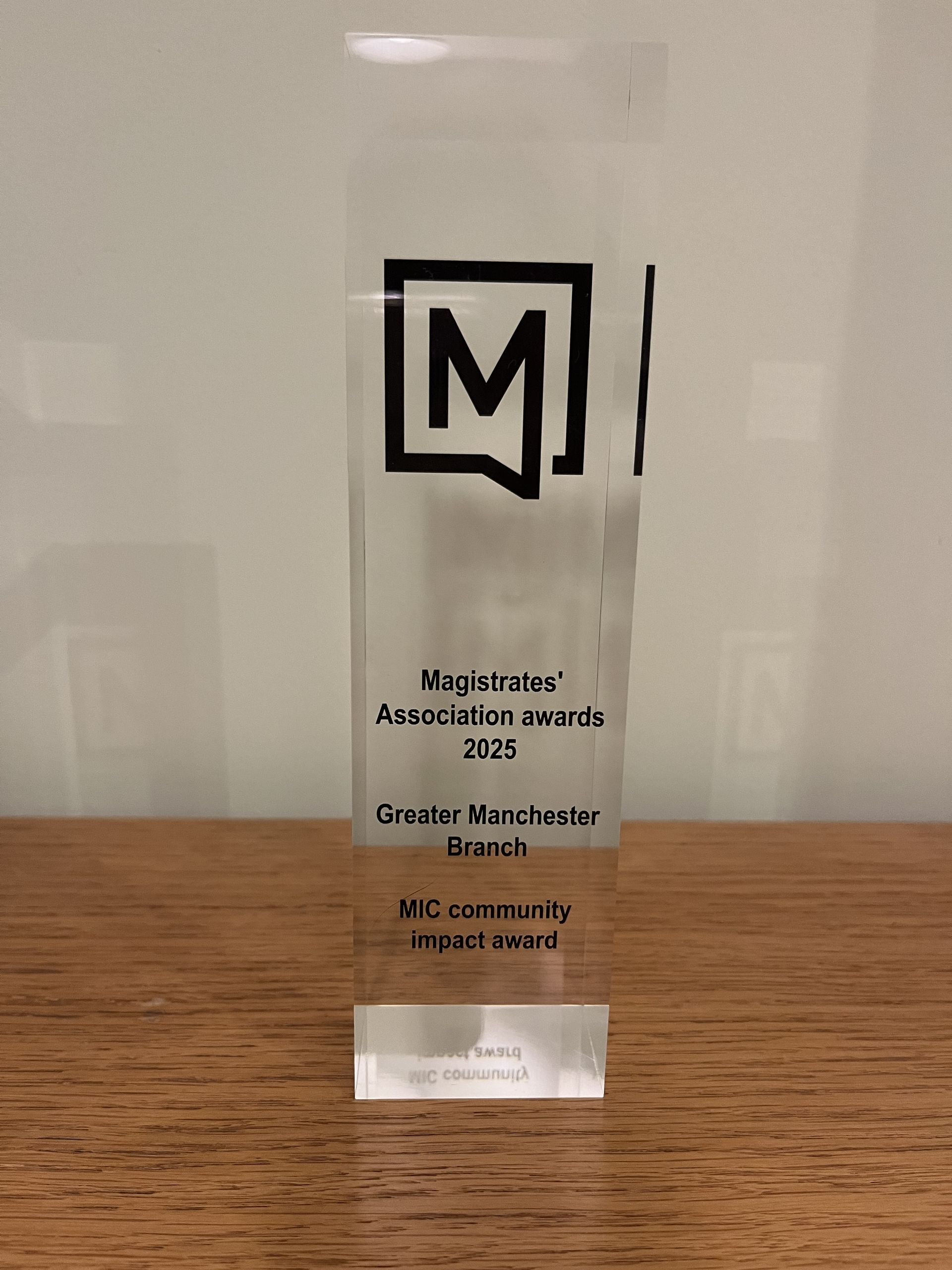 Picture of the MA MIC Community Impact Award trophy