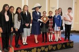 The High Sheriff presenting the winners shield