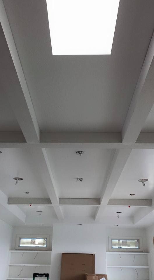 There is a skylight in the ceiling of the room.