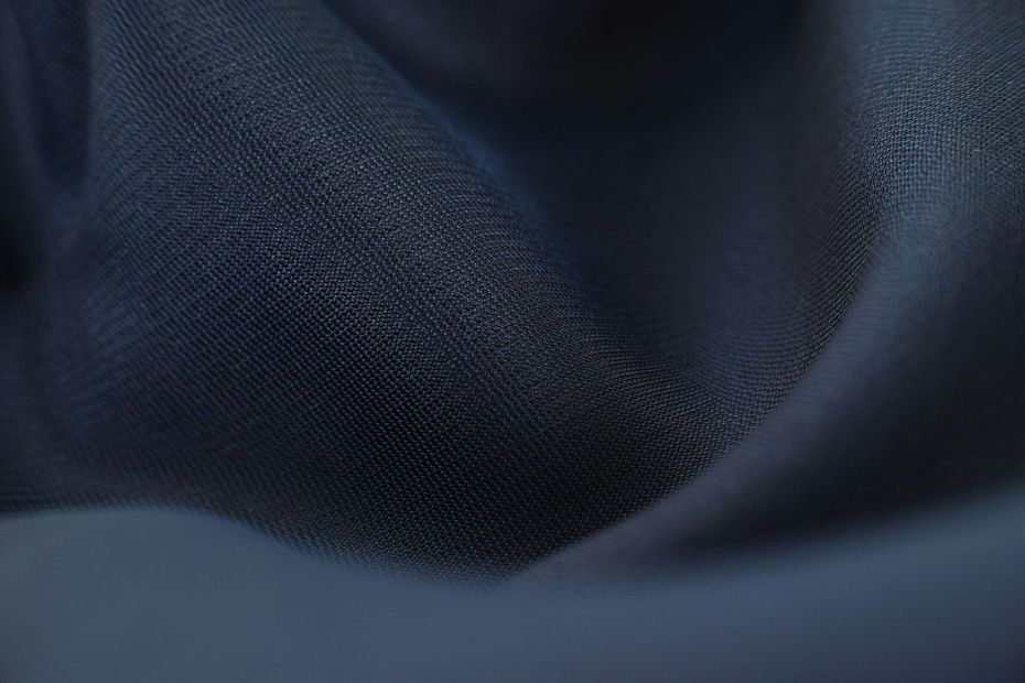 A close up of a piece of Richer Plan blue fabric.
