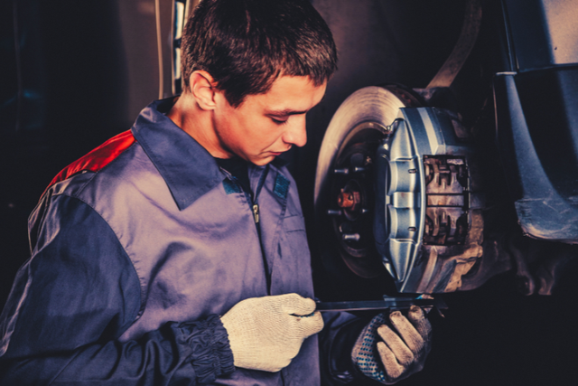 Technician working on brakes