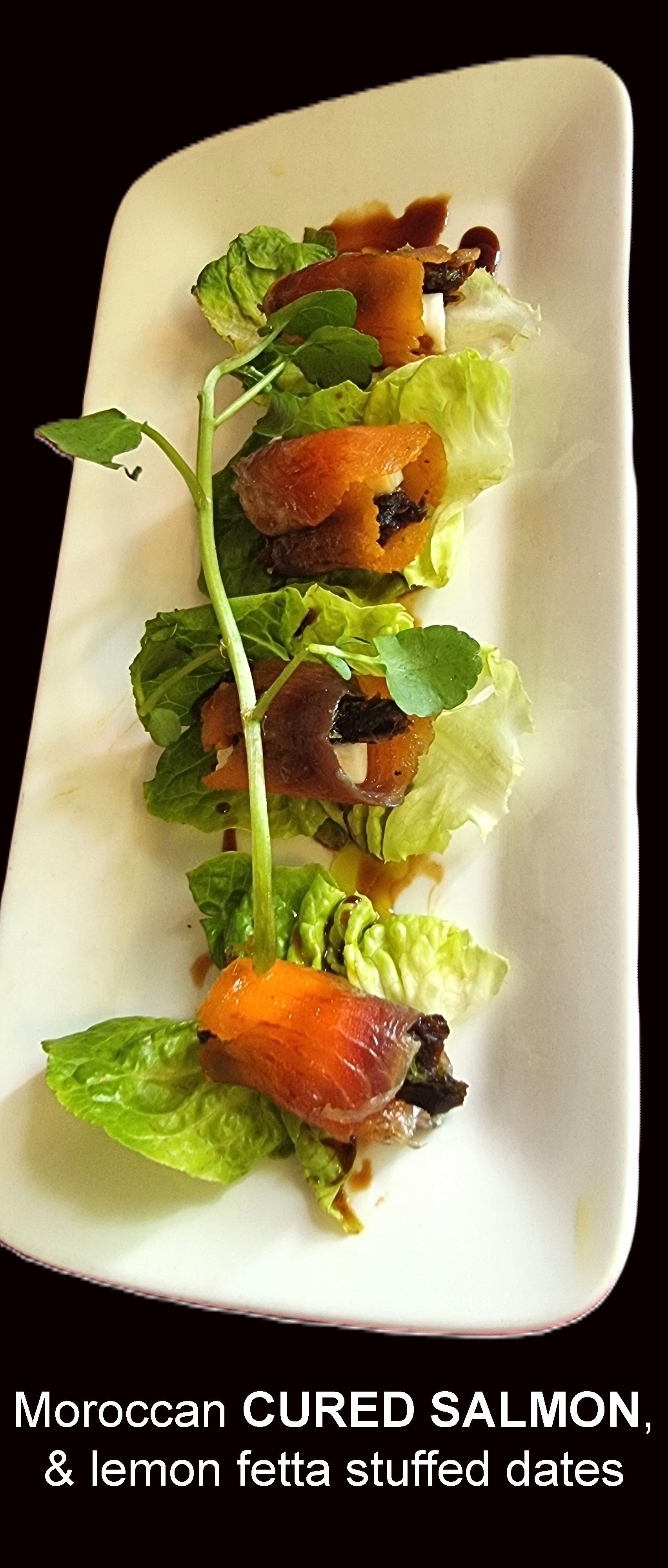 Moroccan Cured Salmon and Lemon feta Stuffed dates on a White plate  — Wayne & Adele's Garden of Eating BYO Restaurant In South Townsville, QLD