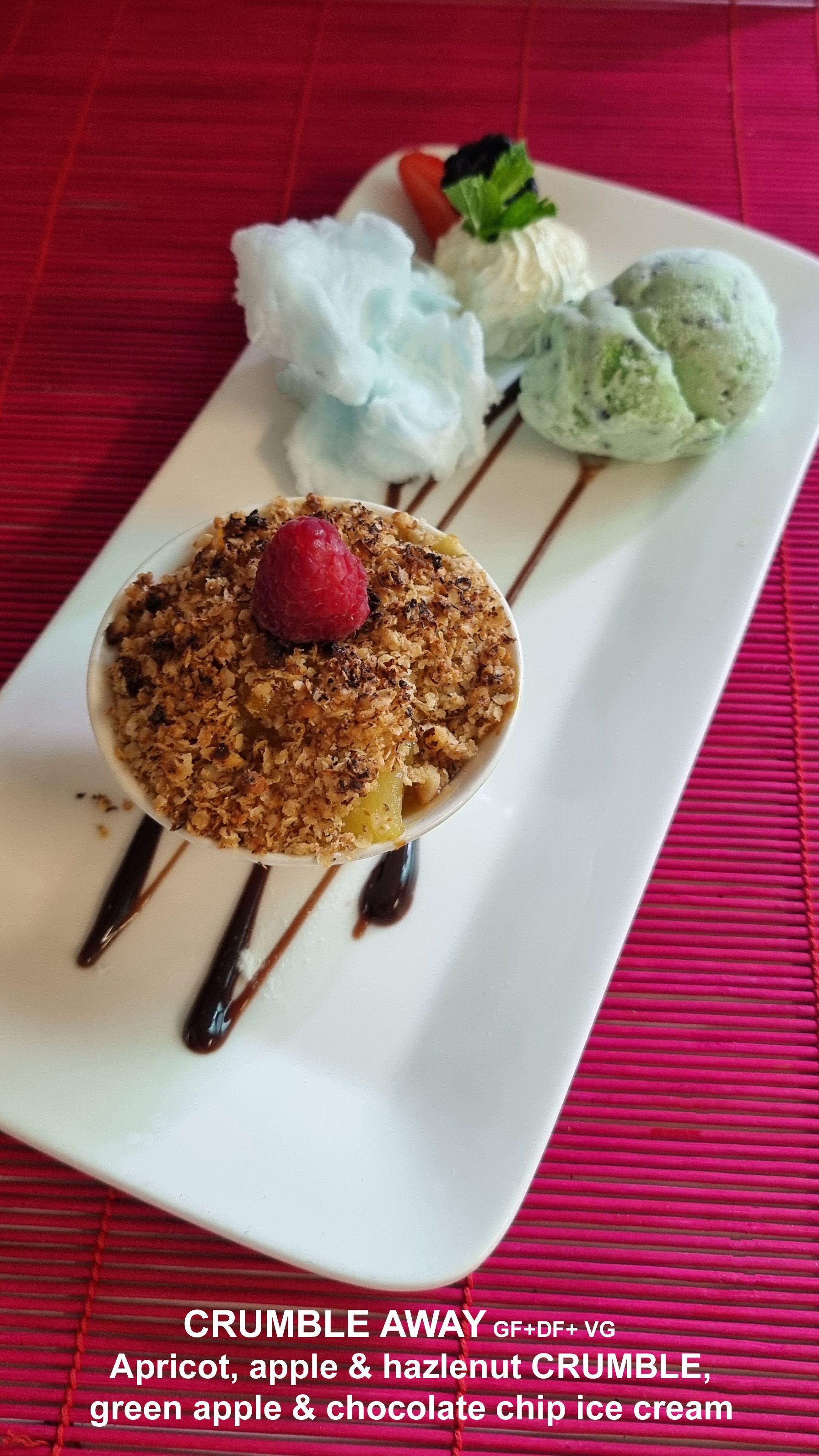 A white plate Topped with a Dessert and ice cream  — Wayne & Adele's Garden of Eating BYO Restaurant In South Townsville, QLD