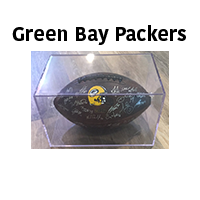 Green Bay Packers football, black with signatures, in a clear display case.