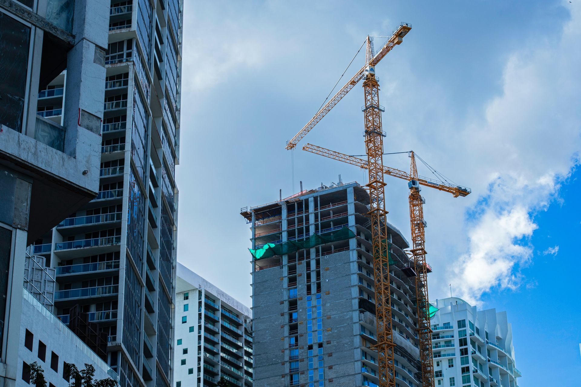 A young man is helping an older man with his medication.