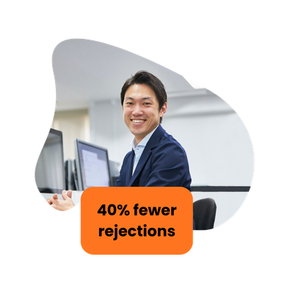 Smiling man at a computer, orange box reads