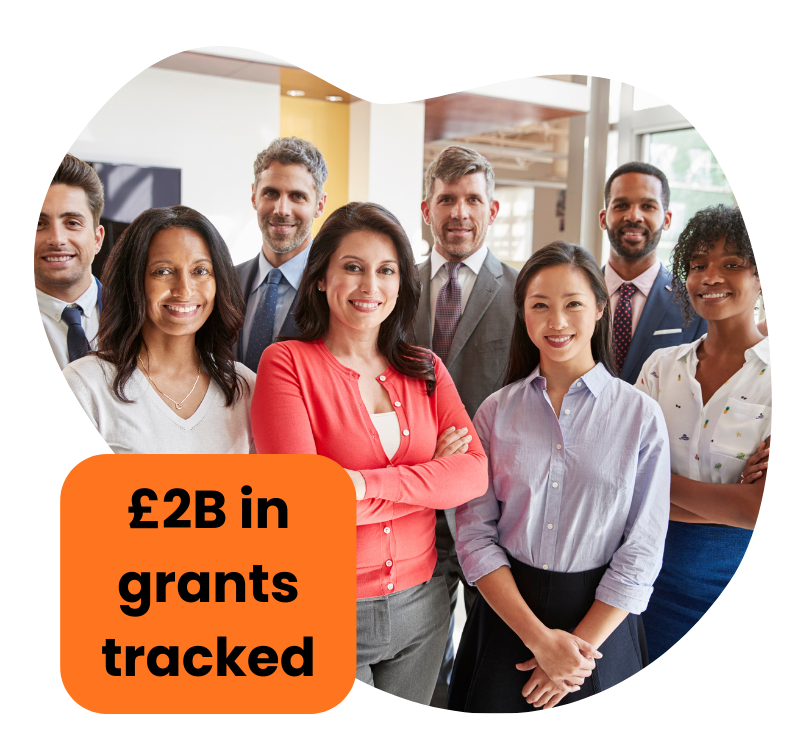 Group of diverse professionals smiling in office with text 