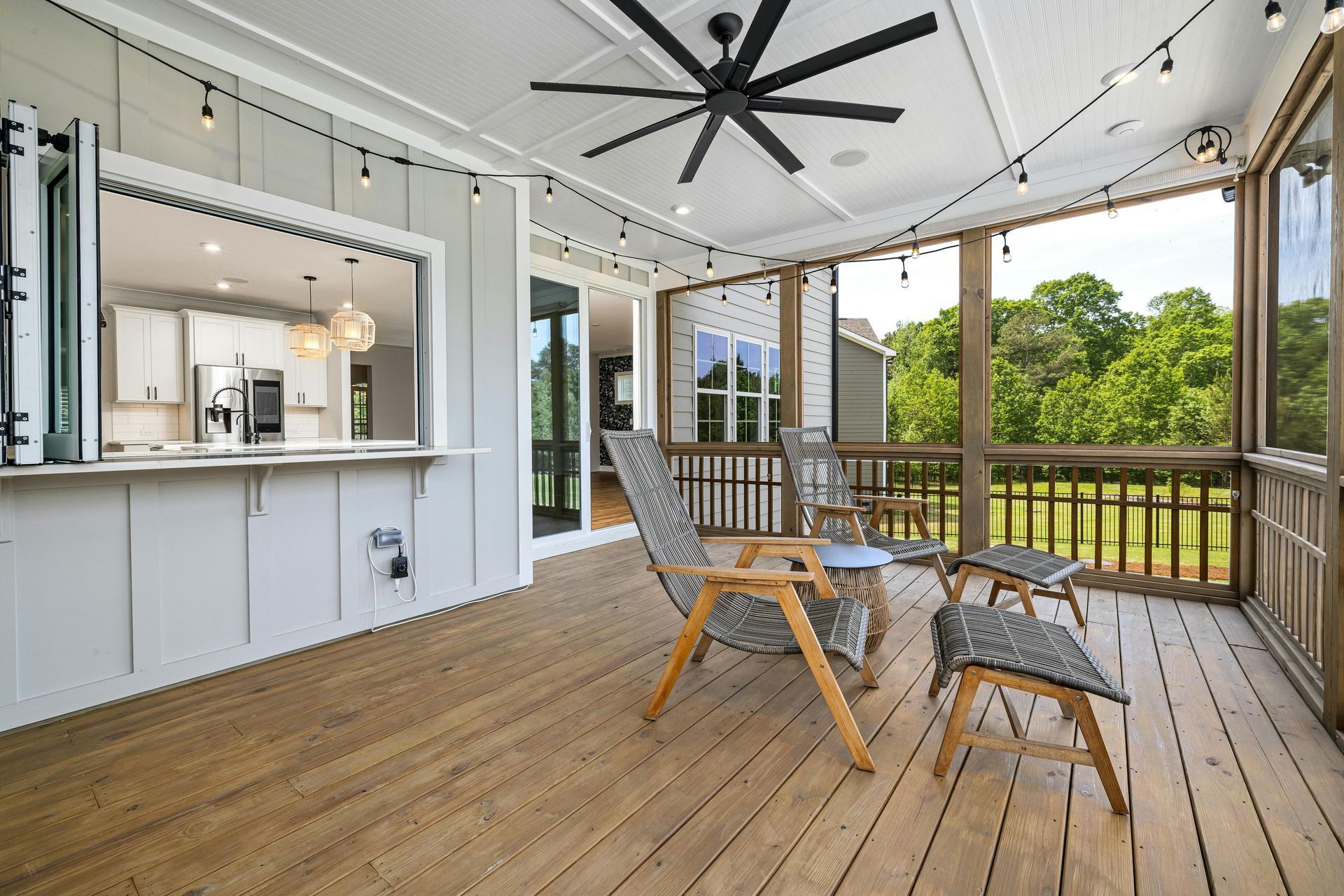 light grey board and batten siding with accordion windows in covered wood deck Chesapeake VA