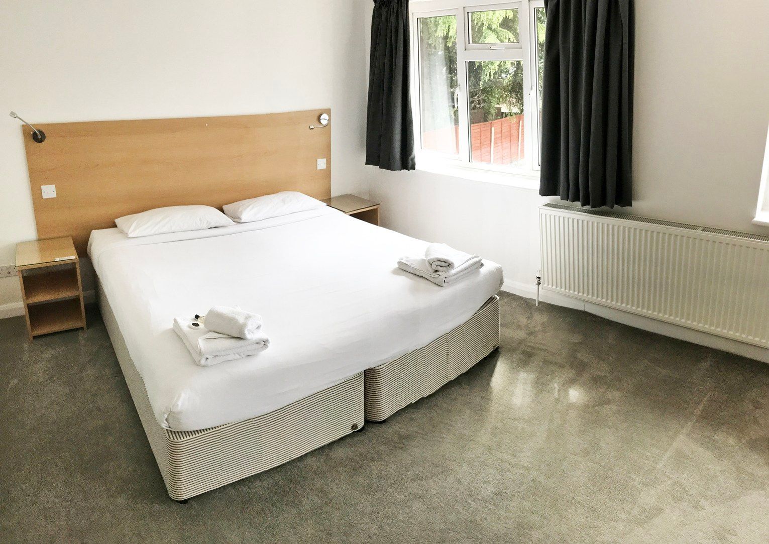 There is a large bed in the middle of the room.