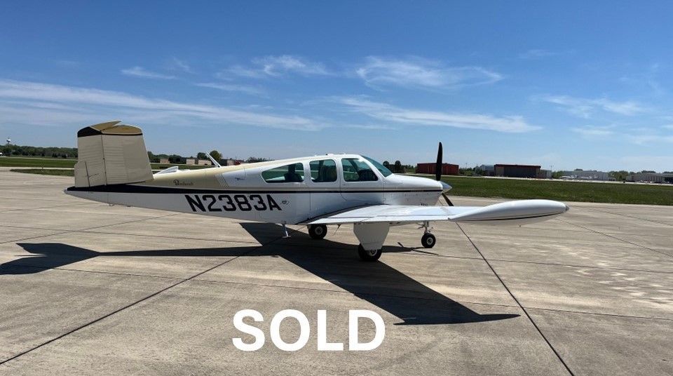 A small airplane is parked in a hangar.