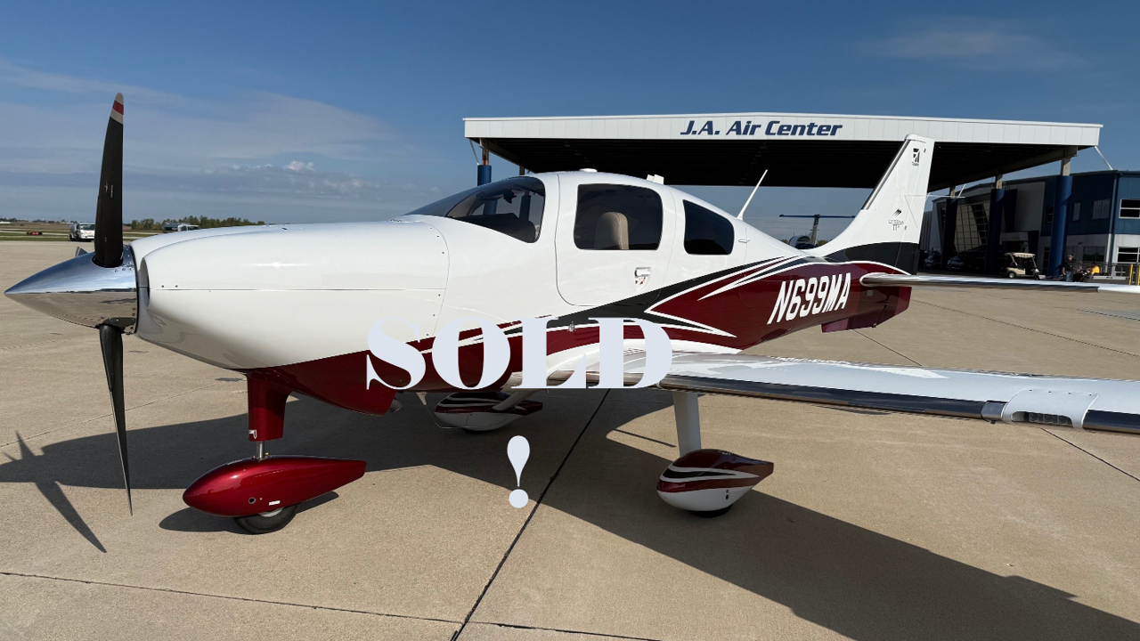 A small yellow and white plane with the numbers n355ac on the side