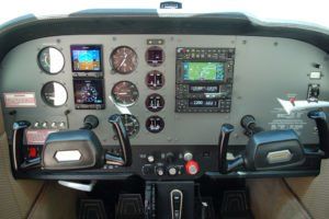 The cockpit of an airplane with a lot of instruments on it.