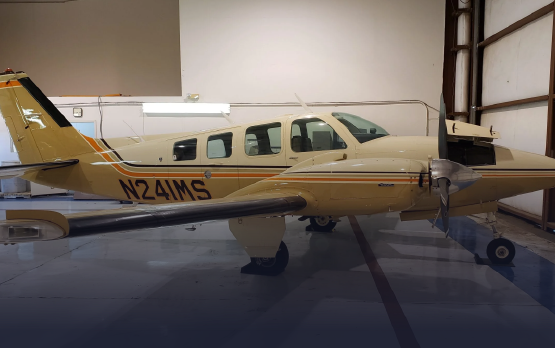 A small plane with the numbers n241ms on the side