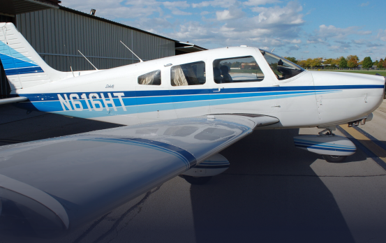 A small plane with n818ht written on the side