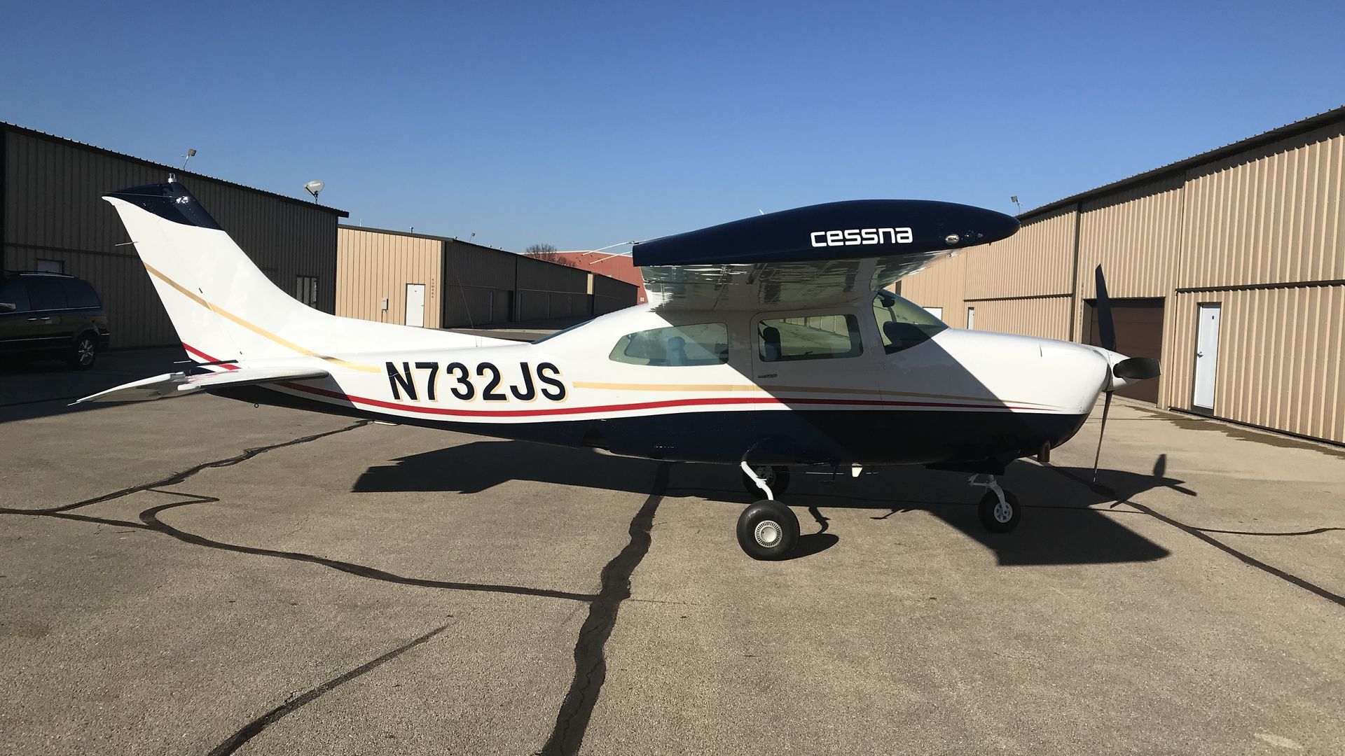 A blue and white airplane with n71rl written on the side