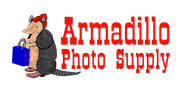 Armadillo Photo Supply logo, illustration of armadillo in a red hat, holding a blue shopping bag