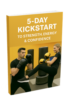 A man and a woman are kickboxing in a gym.