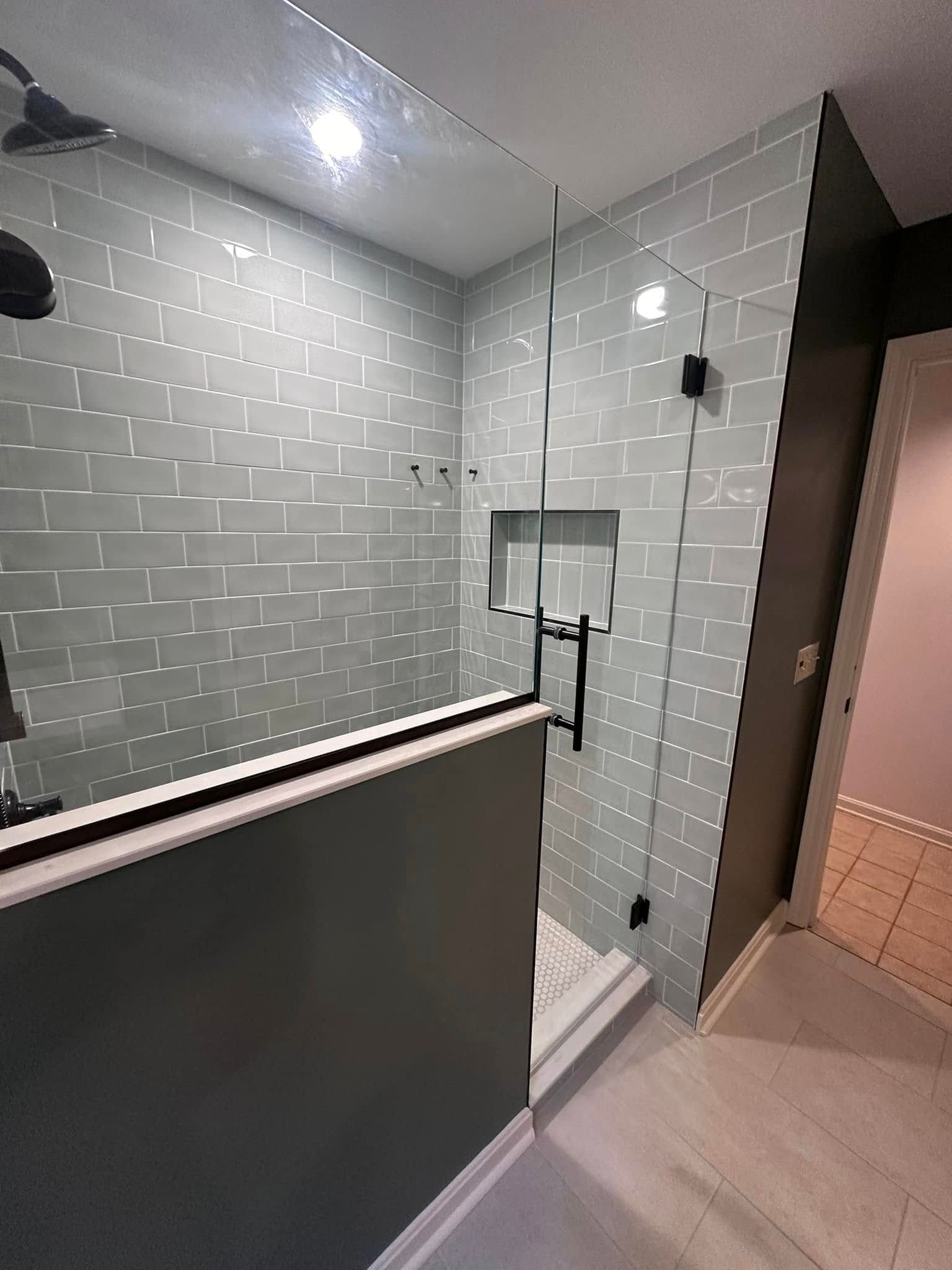 A bathroom with a sink, mirror and window.