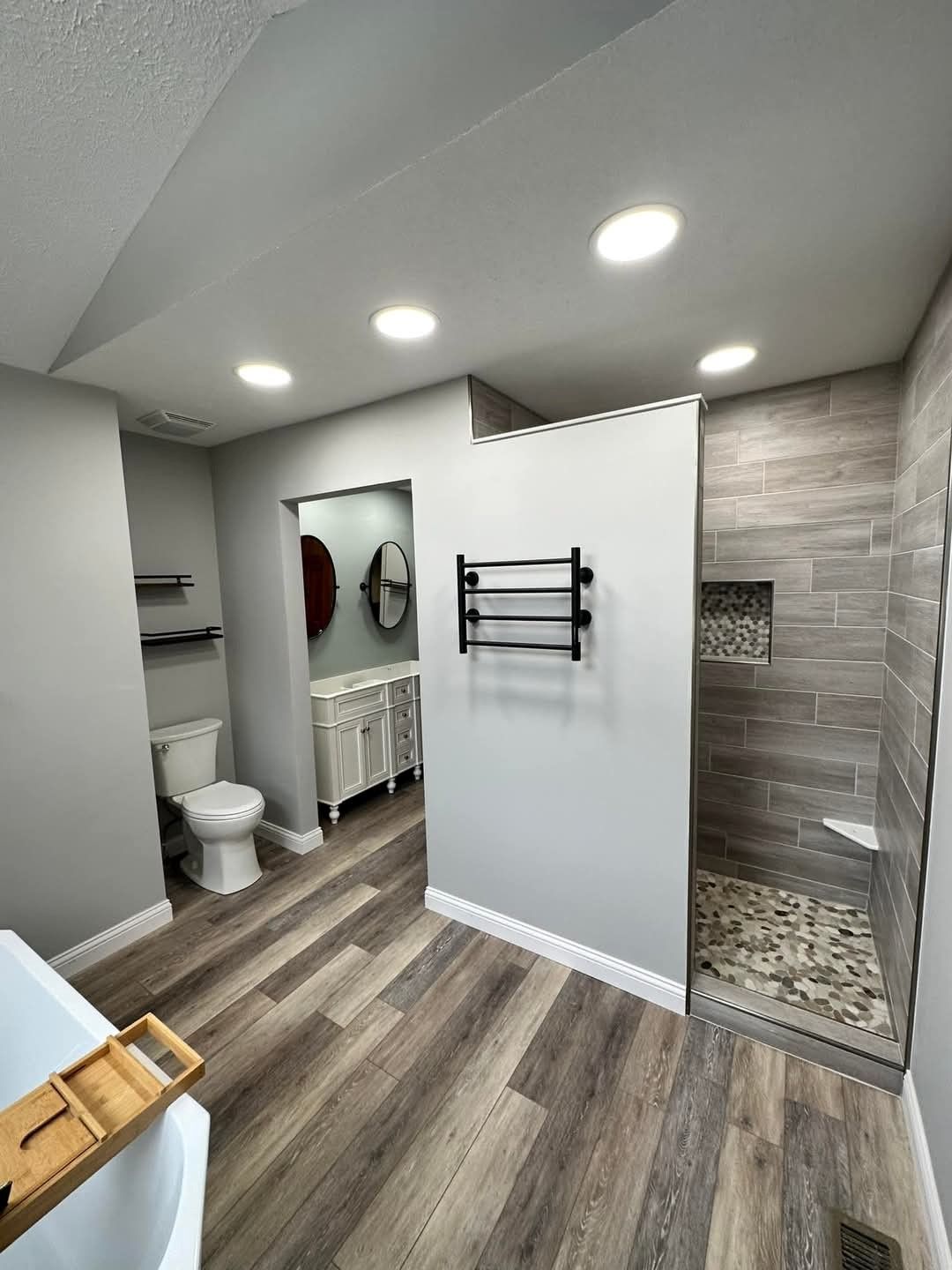 A bathroom with two sinks and two mirrors.