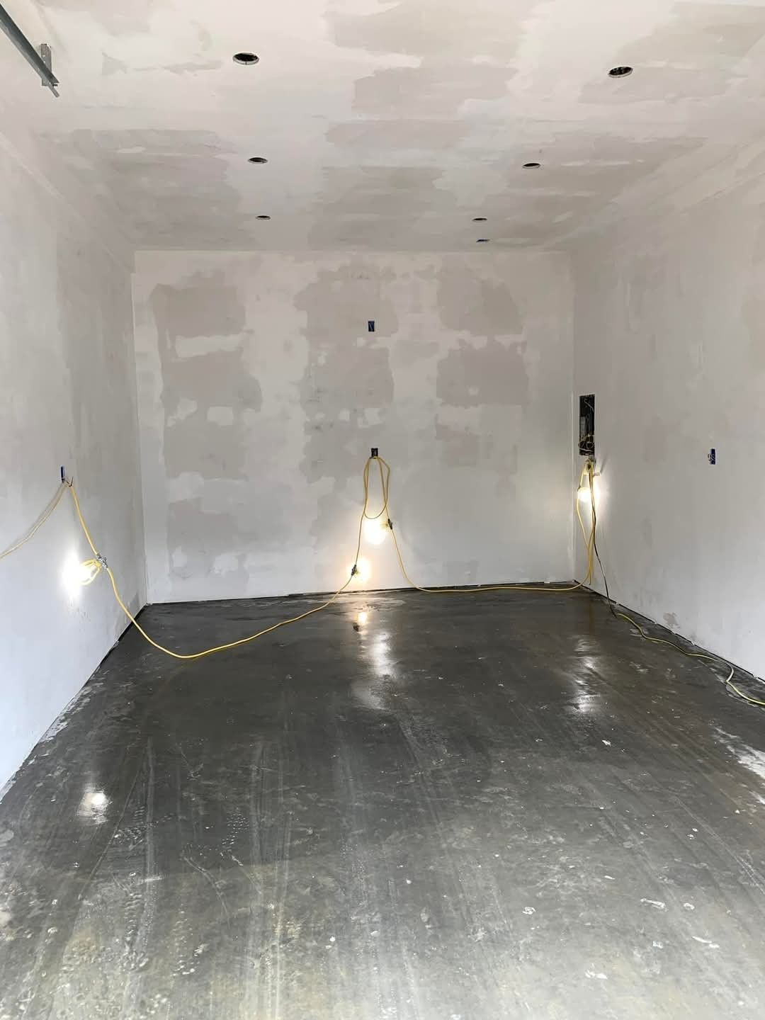 A kitchen with a lot of cabinets and a window.