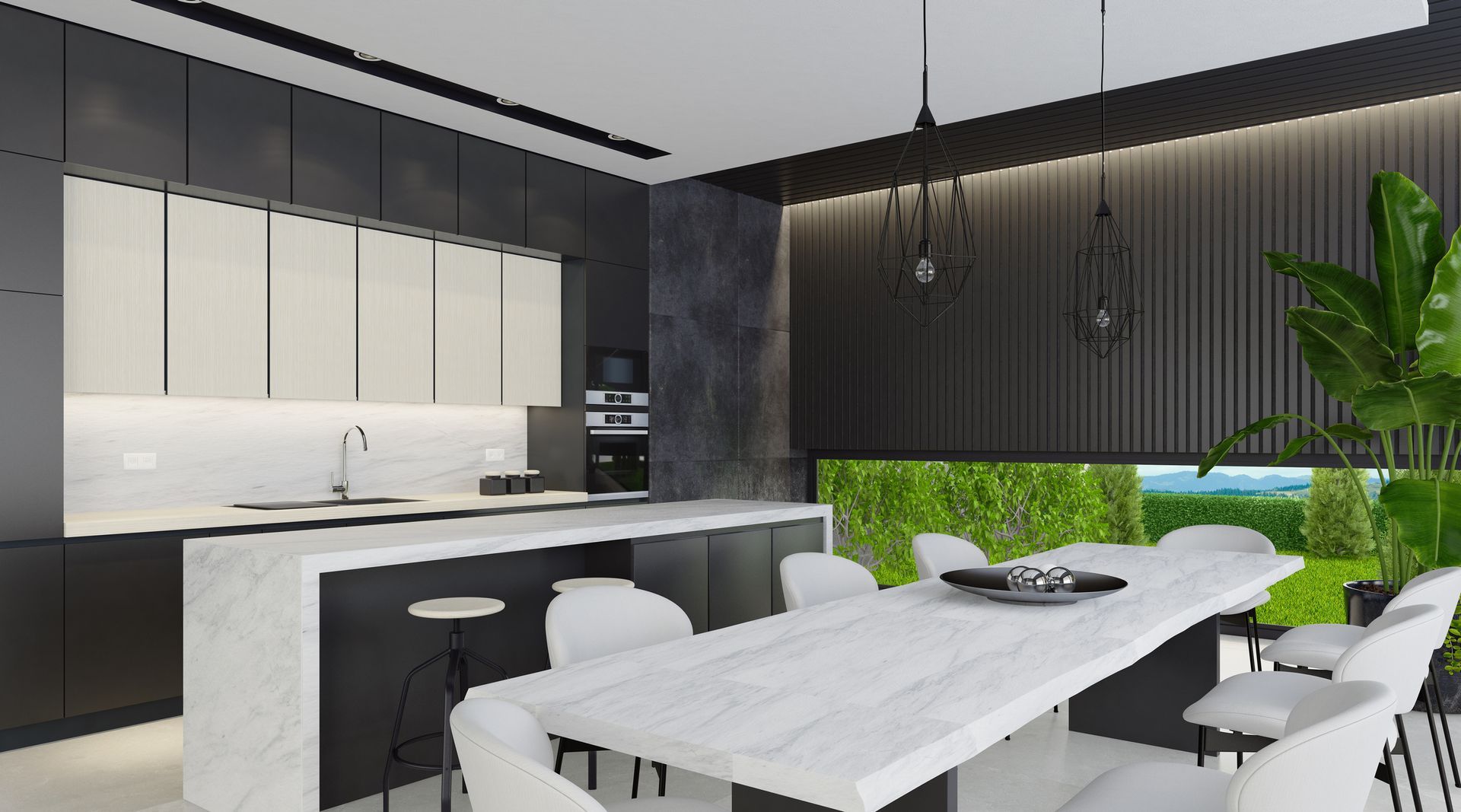 Modern kitchen with black and white cabinets, marble island, and dining table overlooking a green landscape.