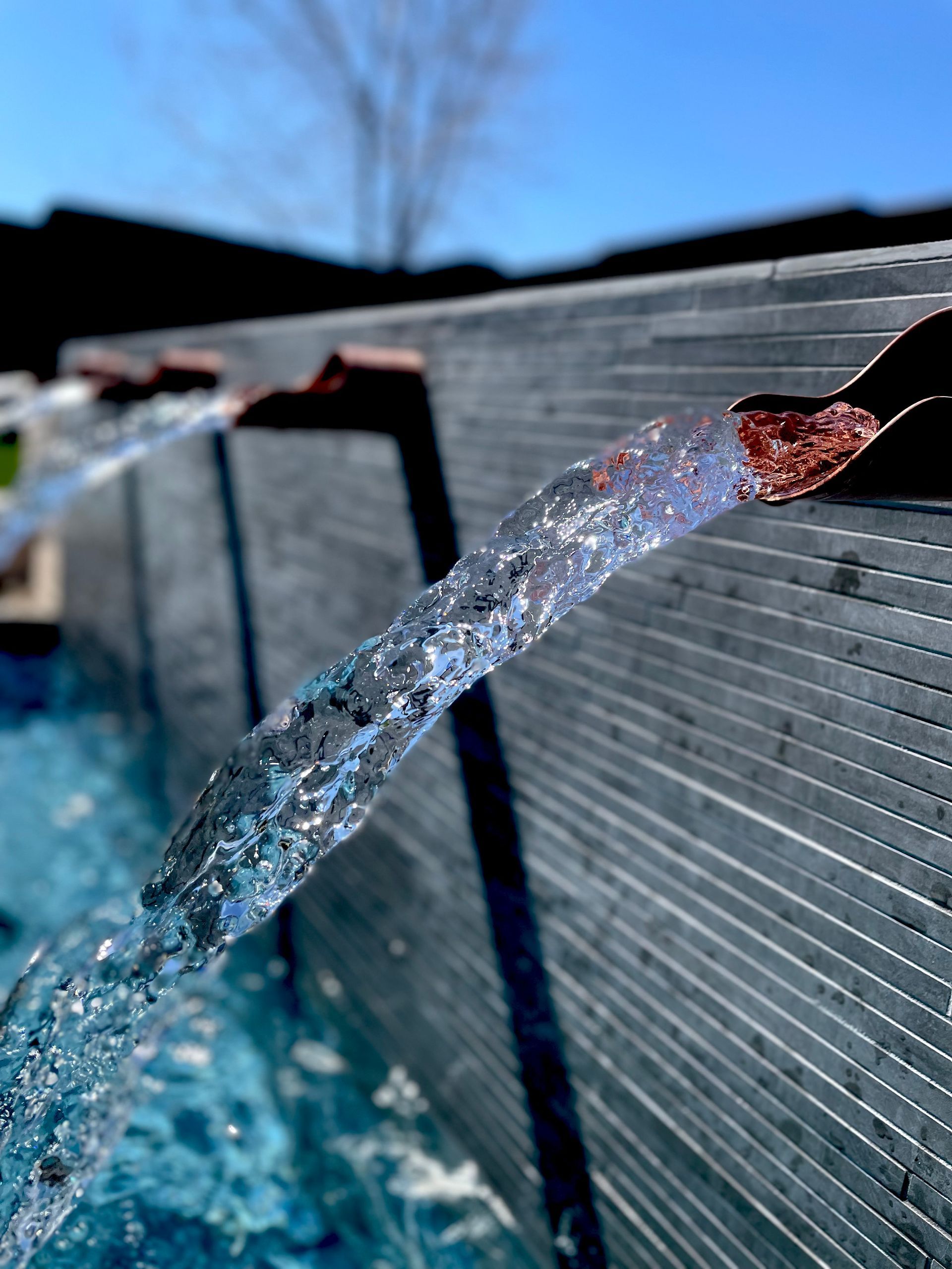 A close up of a water fountain with water coming out of it.