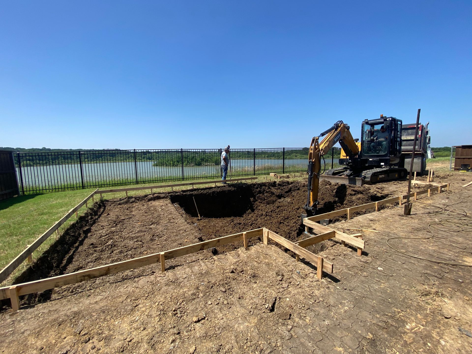 A large excavator is digging a hole in the ground.