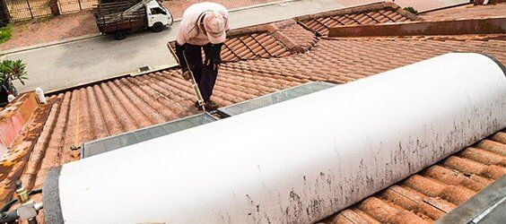 A hot water system installed on a roof in Tweed Heads - Hipwell Plumbing