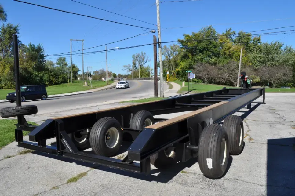 A trailer is parked on the side of the road