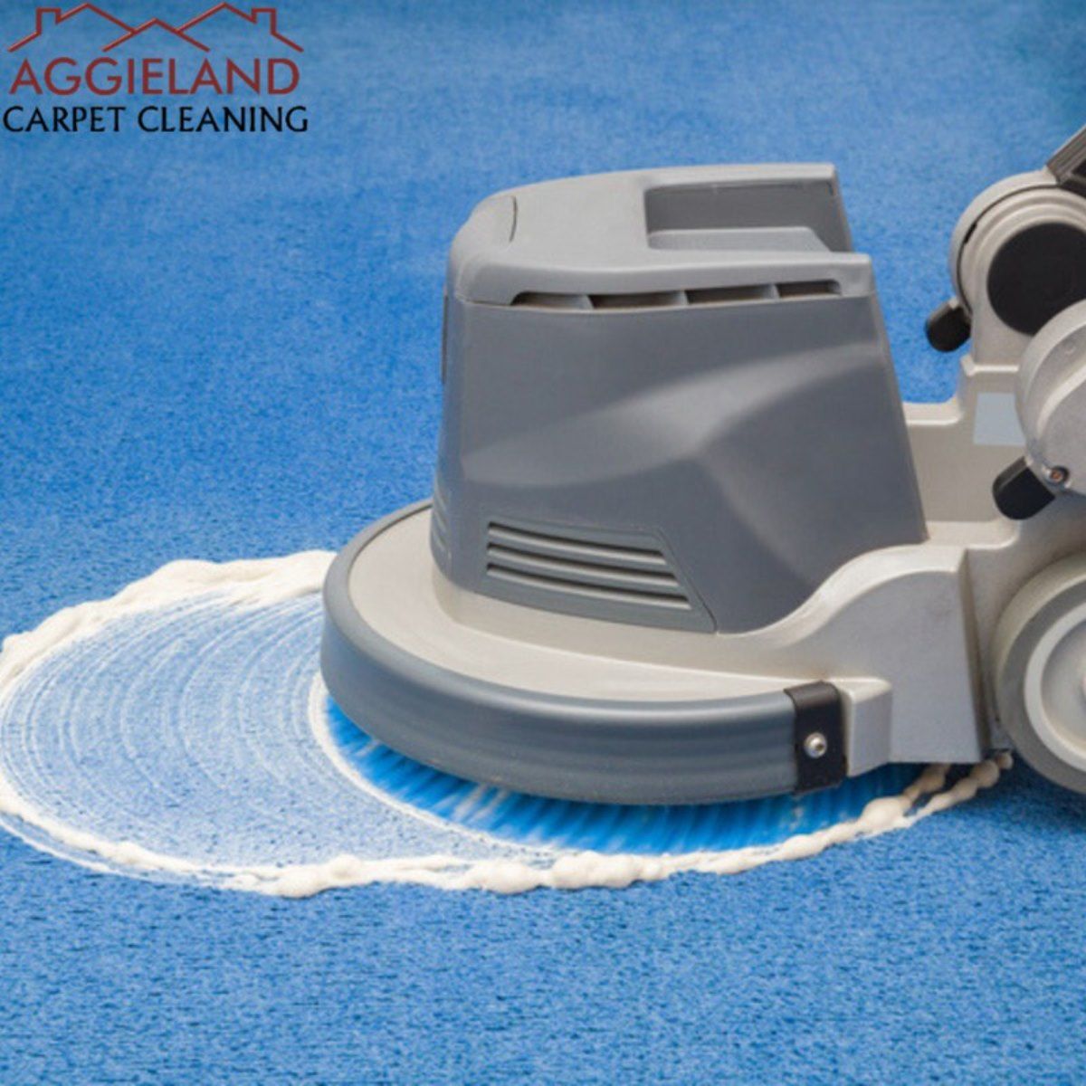 an aggieland carpet cleaning machine is cleaning a blue carpet