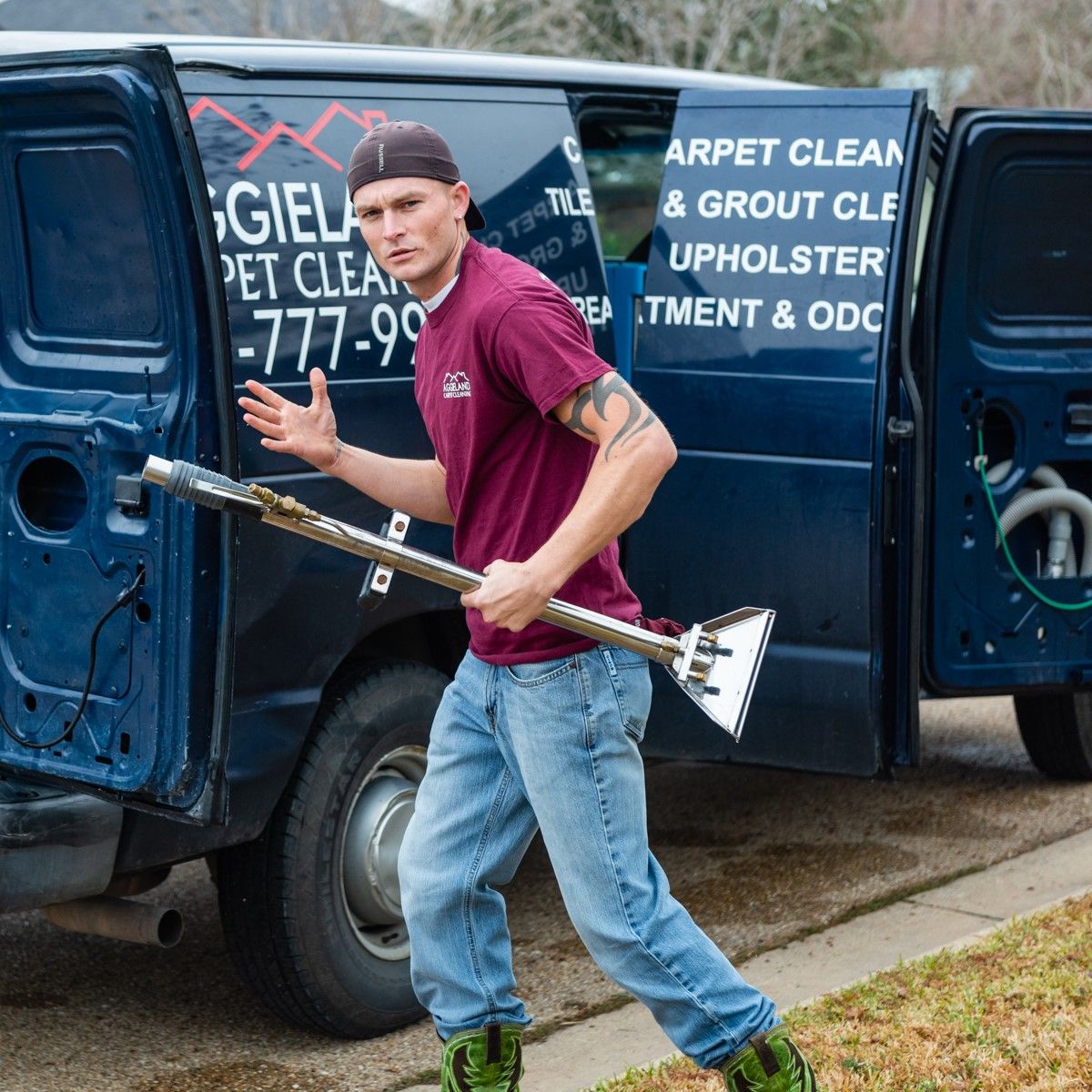 a man holding a vacuum cleaner in front of a van that says carpet clean