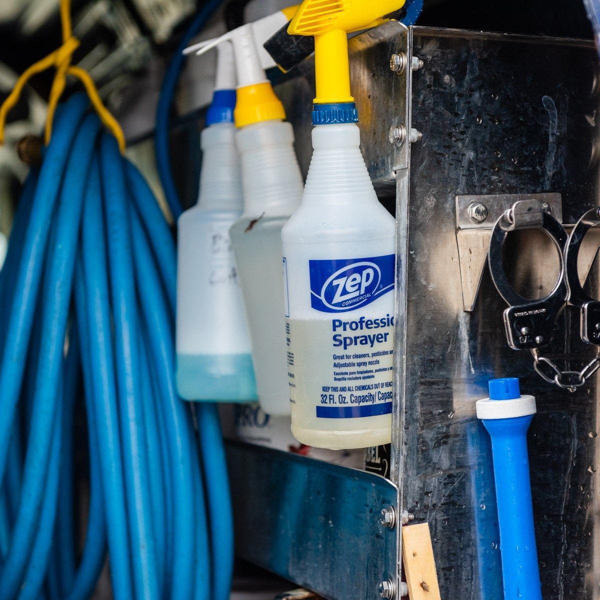 a bottle of zep professional sprayer hanging on a wall