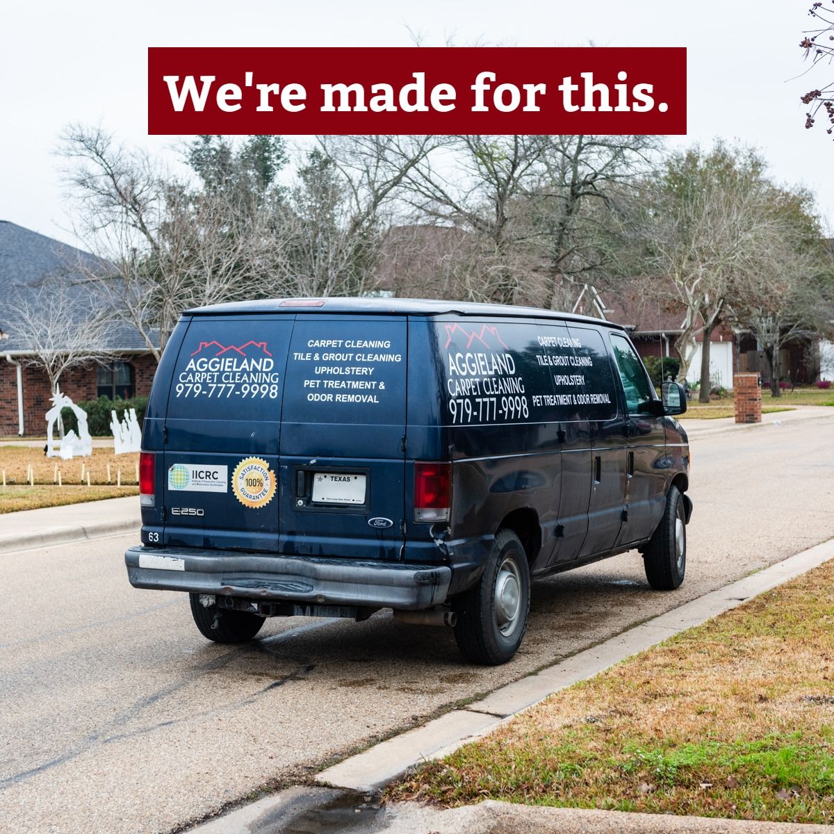 a blue van is parked on the side of the road .