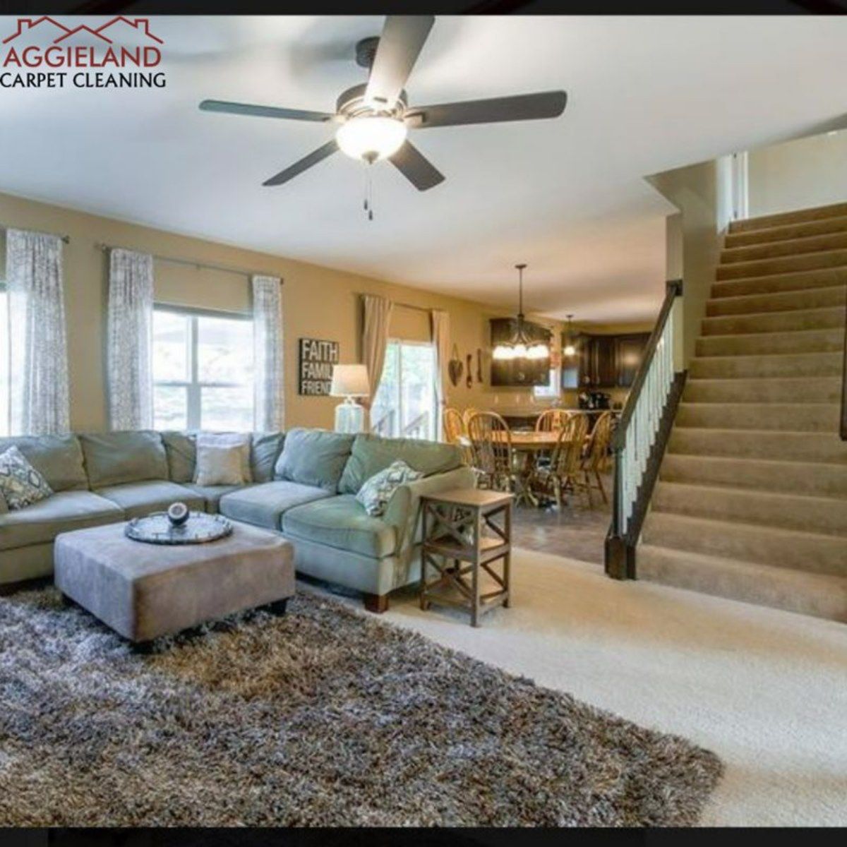 a living room with a couch ottoman and a ceiling fan from aggieland carpet cleaning