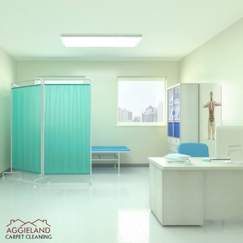 a room with a blue curtain and a sign that says aggieland carpet cleaning