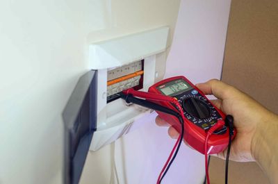 Electrician Checking Status of Electrical Panel for Affordable Electrical Repair