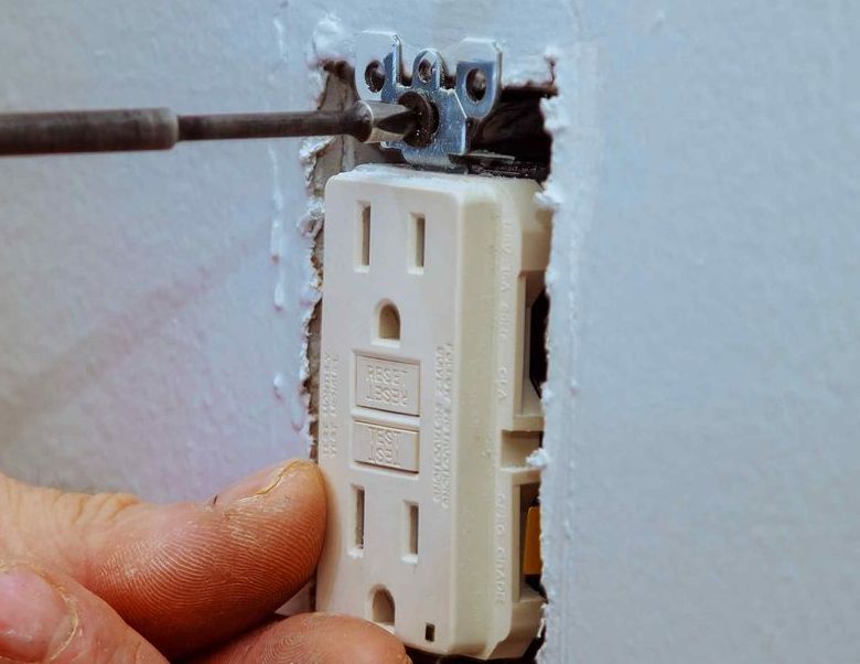 Unscrewing And Removing Old Electrical Outlet