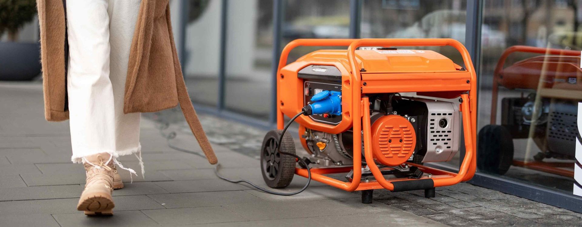 Woman Walks On Street With Gas Generator Providing Power To Small Business