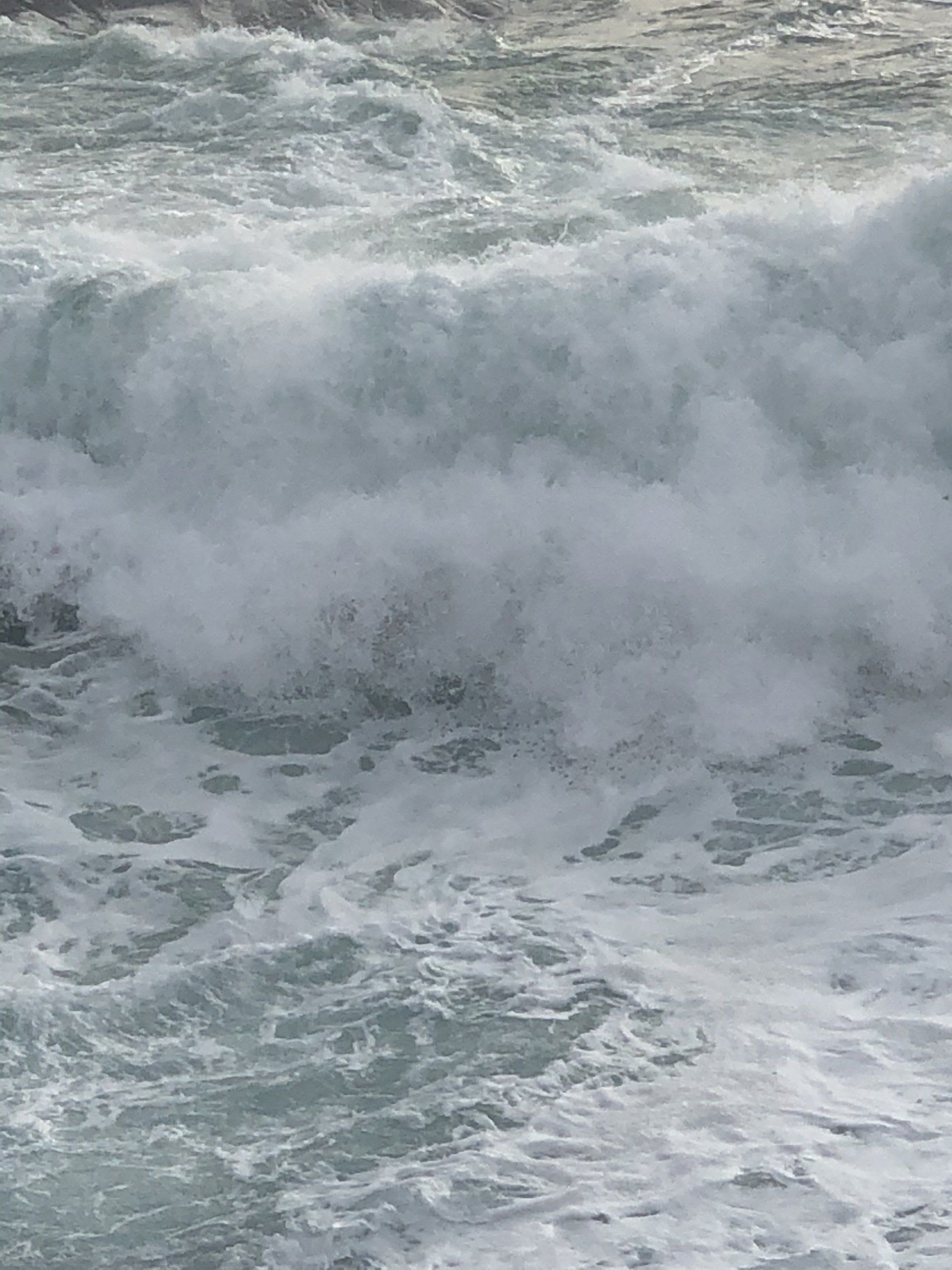 A close up of a large wave in the ocean