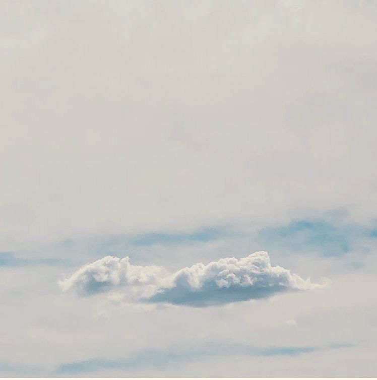 A couple of clouds floating in the sky.