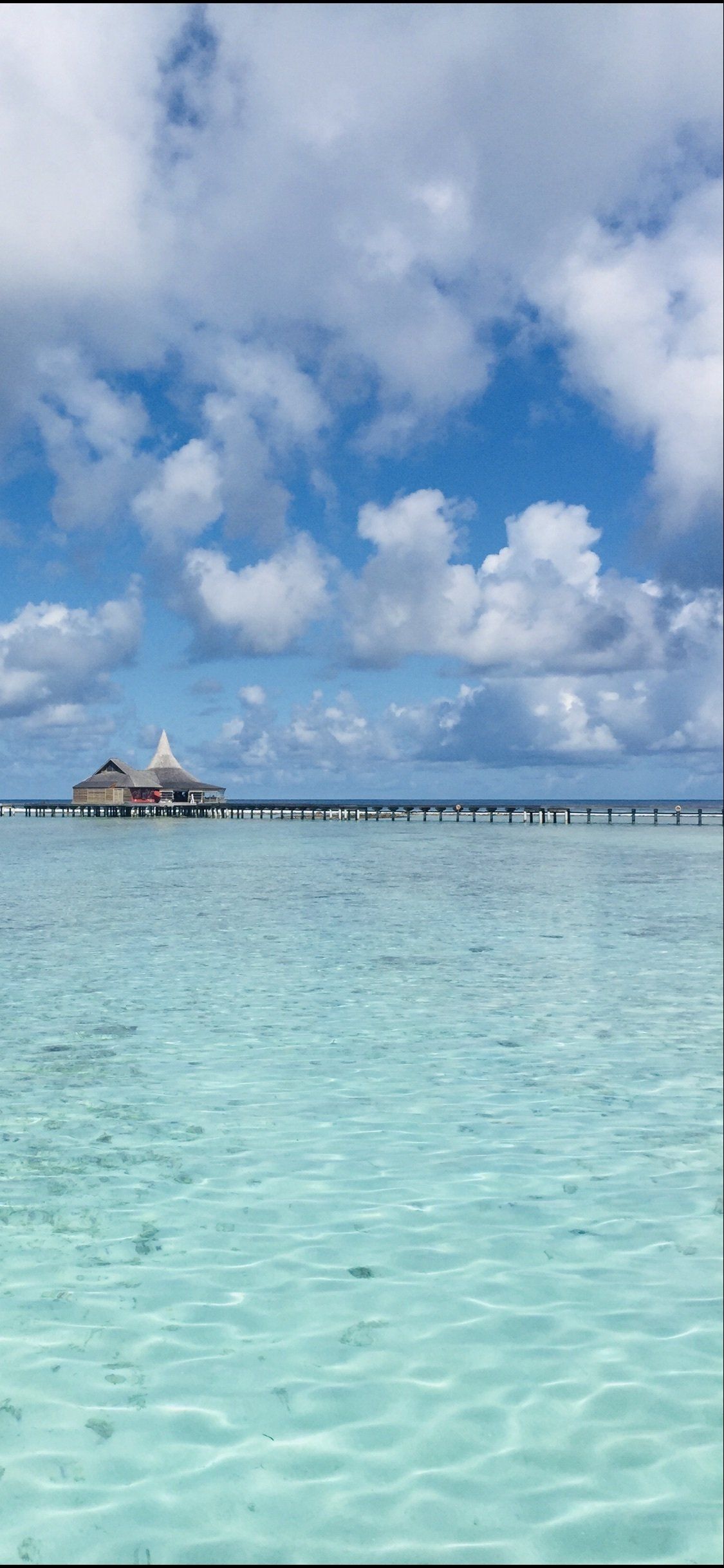 A dock in the middle of a body of water