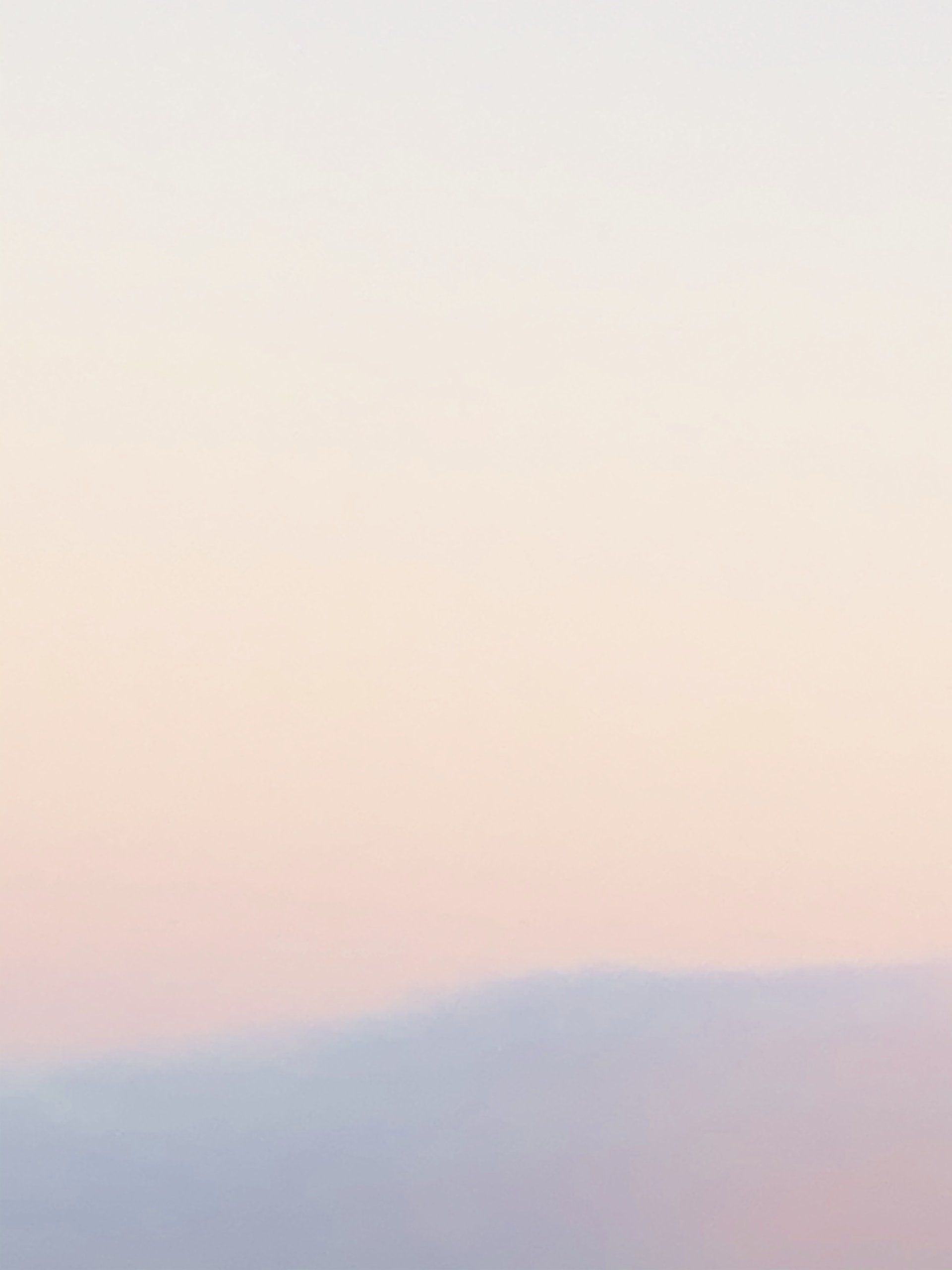 A plain white background with a gradient of pink and blue.