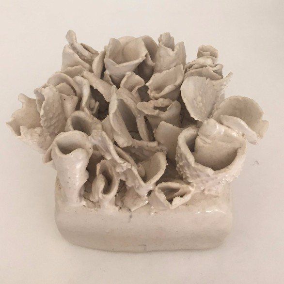 A sculpture of a coral reef made of clay
