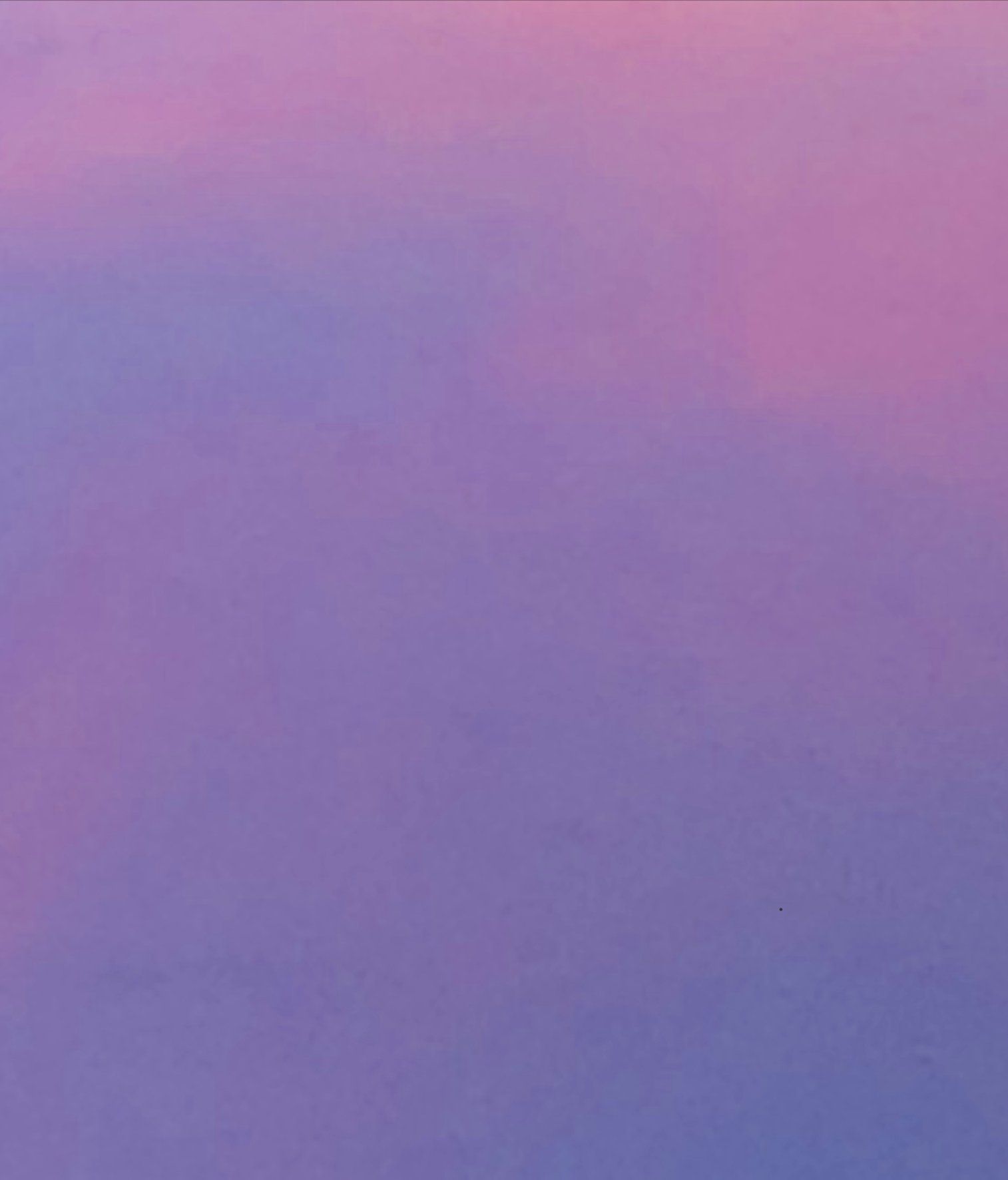 A close up of a purple and pink gradient background.