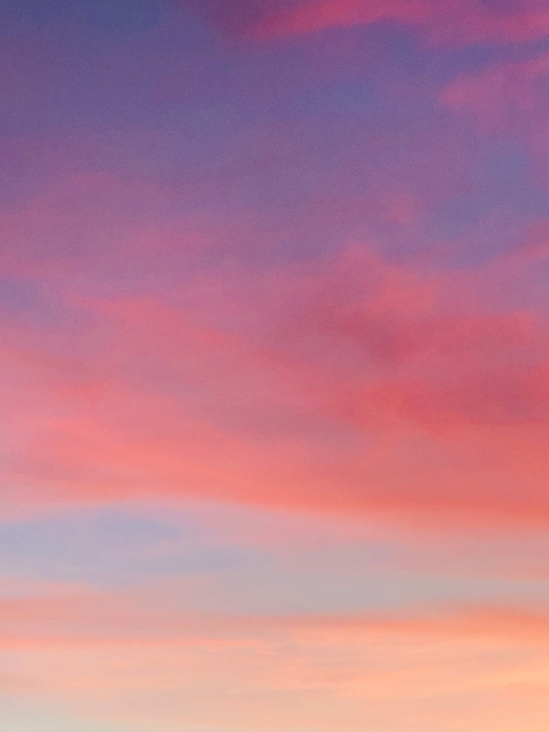 A colorful sunset sky with pink , purple and blue clouds