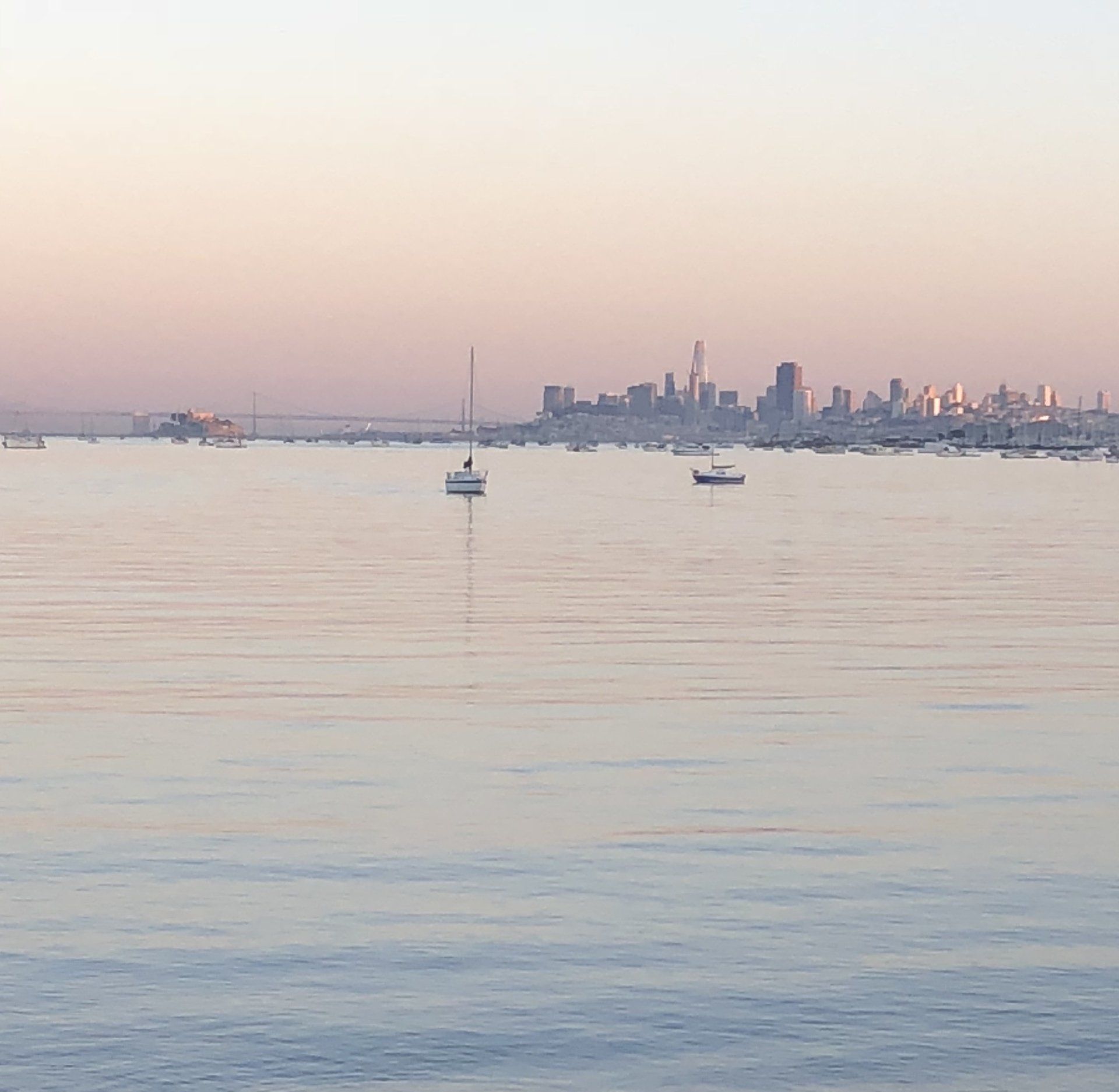 A large body of water with a city in the background