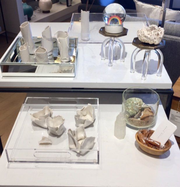 A table with various objects on it including a snow globe