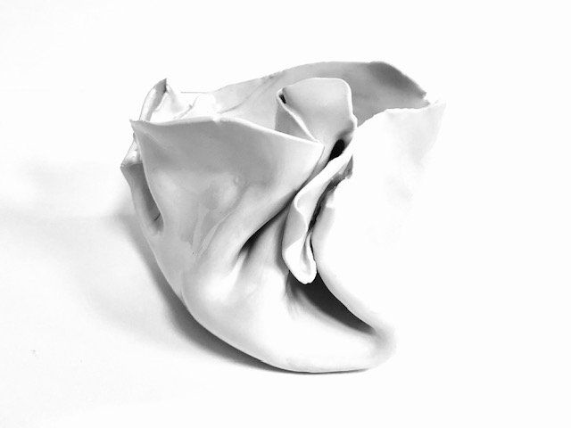 A white object is sitting on a white surface.