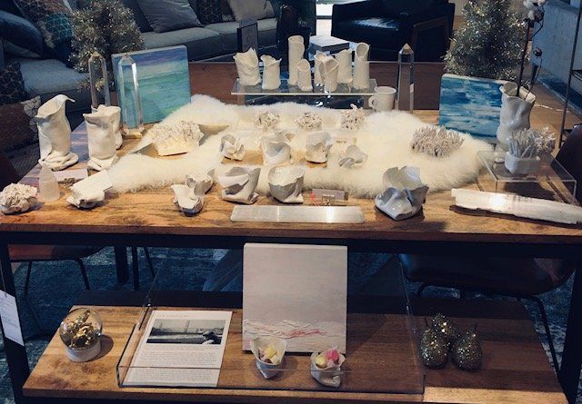 A wooden table with a lot of objects on it